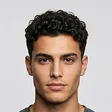 Match: a man with similar features and a tapered curly crop